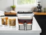 Cold-Brew-Coffee-Maker on table with two cups of coffee