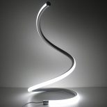 spiral led table lamp lighted on table