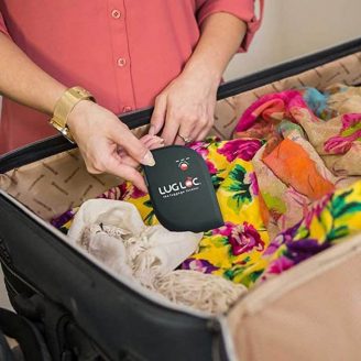 Luggage-Tracking-Device being put into a suitcase