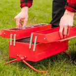 Toolbox-Barbeque-Grill being opened and set up in a park